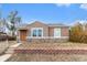Charming ranch home with stone accents and a well-maintained front yard at 4545 Raritan St, Denver, CO 80211