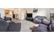 Spacious living room with hardwood floors and ample natural light at 4545 Raritan St, Denver, CO 80211