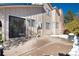 Back patio with sliding glass doors and a small yard at 6350 E Mineral Pl, Centennial, CO 80112