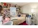 Bedroom with a full-size bed and eclectic wall art at 1709 Arapahoe Ave, Boulder, CO 80302