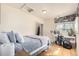 Cozy bedroom featuring a bed, desk, and hardwood floors at 1709 Arapahoe Ave, Boulder, CO 80302