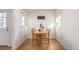 Simple dining area with wood table and four chairs at 1709 Arapahoe Ave, Boulder, CO 80302