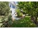 Landscaped backyard with stone wall and deck at 10799 Eagle Crest Ct, Parker, CO 80138