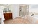 Elegant bathroom with soaking tub, shower, and double vanity at 10799 Eagle Crest Ct, Parker, CO 80138