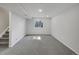 Unfinished basement with grey carpet and a small window at 9799 Burberry Way, Highlands Ranch, CO 80129