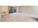 Living room with carpeted floors and sliding glass door to balcony at 350 S Clinton St # 7A, Denver, CO 80247