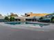 Community pool with surrounding patio and landscaping at 350 S Clinton St # 7A, Denver, CO 80247