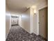 Building hallway with carpeted floor and neutral walls at 350 S Clinton St # 7A, Denver, CO 80247