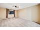 Bright bedroom with neutral walls, carpet, and a ceiling fan at 350 S Clinton St # 7A, Denver, CO 80247