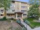Daytime view of apartment building exterior with landscaping at 350 S Clinton St # 7A, Denver, CO 80247