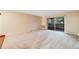 Living room with carpeted floor and sliding glass door to balcony at 350 S Clinton St # 7A, Denver, CO 80247