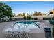 Community pool with surrounding patio and landscaping at 350 S Clinton St # 7A, Denver, CO 80247