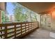 Private patio with brick wall and treetop views at 350 S Clinton St # 7A, Denver, CO 80247