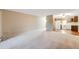 Living room with carpeted floor and open kitchen at 350 S Clinton St # 7A, Denver, CO 80247