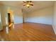 Bright bedroom featuring hardwood floors and a ceiling fan at 8135 Eagleview Dr, Littleton, CO 80125