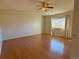 Spacious bedroom with hardwood floors and ceiling fan at 8135 Eagleview Dr, Littleton, CO 80125