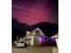 Night view of a house with a yard and purple sky at 902 Virginia St, Idaho Springs, CO 80452