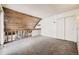 Loft bedroom with wood paneled ceiling and carpet flooring at 2604 S Xanadu Way # B, Aurora, CO 80014