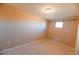 Simple bedroom with neutral colored walls and carpet at 8571 Gold Peak Dr # E, Highlands Ranch, CO 80130