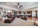 Open concept living room with a view of the kitchen and staircase at 23774 E 36Th Pl, Aurora, CO 80019