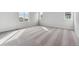 Spacious bedroom filled with natural light from large windows and neutral-colored carpet at 5758 Ranch St, Mead, CO 80504
