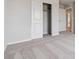 Bedroom with sliding closet doors, neutral carpet, and access to another room at 5758 Ranch St, Mead, CO 80504