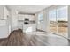 Modern kitchen with white cabinetry, stainless steel appliances, and an island at 5758 Ranch St, Mead, CO 80504