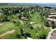 Aerial view of a golf course community with mountain views at 13961 E Marina Dr # 106, Aurora, CO 80014