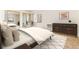 Cozy bedroom with mirrored closet doors and neutral decor at 13961 E Marina Dr # 106, Aurora, CO 80014