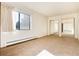 Well-lit bedroom with mirrored closet doors and neutral carpeting at 13961 E Marina Dr # 106, Aurora, CO 80014