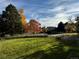 Landscaped lawn area with mature trees and a park-like setting at 13961 E Marina Dr # 106, Aurora, CO 80014
