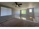 Open loft area with a ceiling fan and window at 16619 E Prairie Wind Ave, Parker, CO 80134