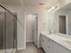 Modern bathroom with double vanity, shower, and linen closet at 13821 Del Corso Way, Broomfield, CO 80020