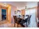 Dining area with a table for six and access to another room at 116 Zante St, Lochbuie, CO 80603