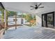 Spacious deck with ceiling fan, access to backyard, and detached garage at 4643 S Cherokee St, Englewood, CO 80110