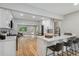 Modern kitchen with white cabinets, quartz counters, and island at 4643 S Cherokee St, Englewood, CO 80110