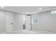 Finished basement room with a door to a bathroom and a window at 4643 S Cherokee St, Englewood, CO 80110