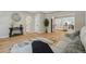 Living room with hardwood floors and view into kitchen at 4643 S Cherokee St, Englewood, CO 80110