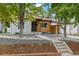 Modern craftsman style home with a carport and landscaped yard at 4643 S Cherokee St, Englewood, CO 80110