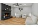 Living room with fireplace, hardwood floors, and comfy seating at 4643 S Cherokee St, Englewood, CO 80110