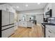 Open concept kitchen with stainless steel appliances at 4643 S Cherokee St, Englewood, CO 80110