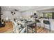 Dining area with table and chairs, open to kitchen at 4643 S Cherokee St, Englewood, CO 80110