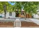 Modern craftsman style home with a carport and landscaped yard at 4643 S Cherokee St, Englewood, CO 80110