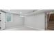 Finished basement room with window, carpet, and neutral walls at 4643 S Cherokee St, Englewood, CO 80110
