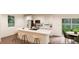 Modern kitchen features island with seating, stainless steel appliances, and white cabinets at , Aurora, CO 80019