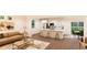 Open concept living room and kitchen with hardwood floors and neutral decor at , Aurora, CO 80019