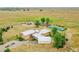 Aerial view of property with home, barn and tennis court at 11881 County Road 37, Fort Lupton, CO 80621