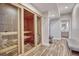 Spacious basement sauna with glass doors and tiled flooring at 1820 S State Highway 83, Franktown, CO 80116