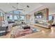 Spacious living area with a modern fireplace and large windows at 1820 S State Highway 83, Franktown, CO 80116