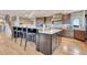 Modern kitchen with large island and stainless steel appliances at 1820 S State Highway 83, Franktown, CO 80116